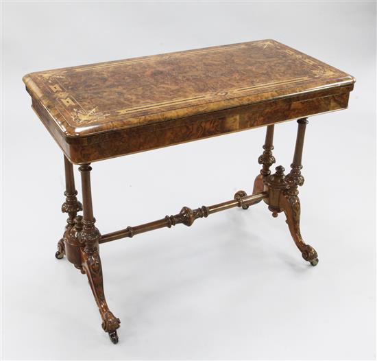 A Victorian burr walnut and marquetry inlaid rectangular folding card table, W.3ft 2in.